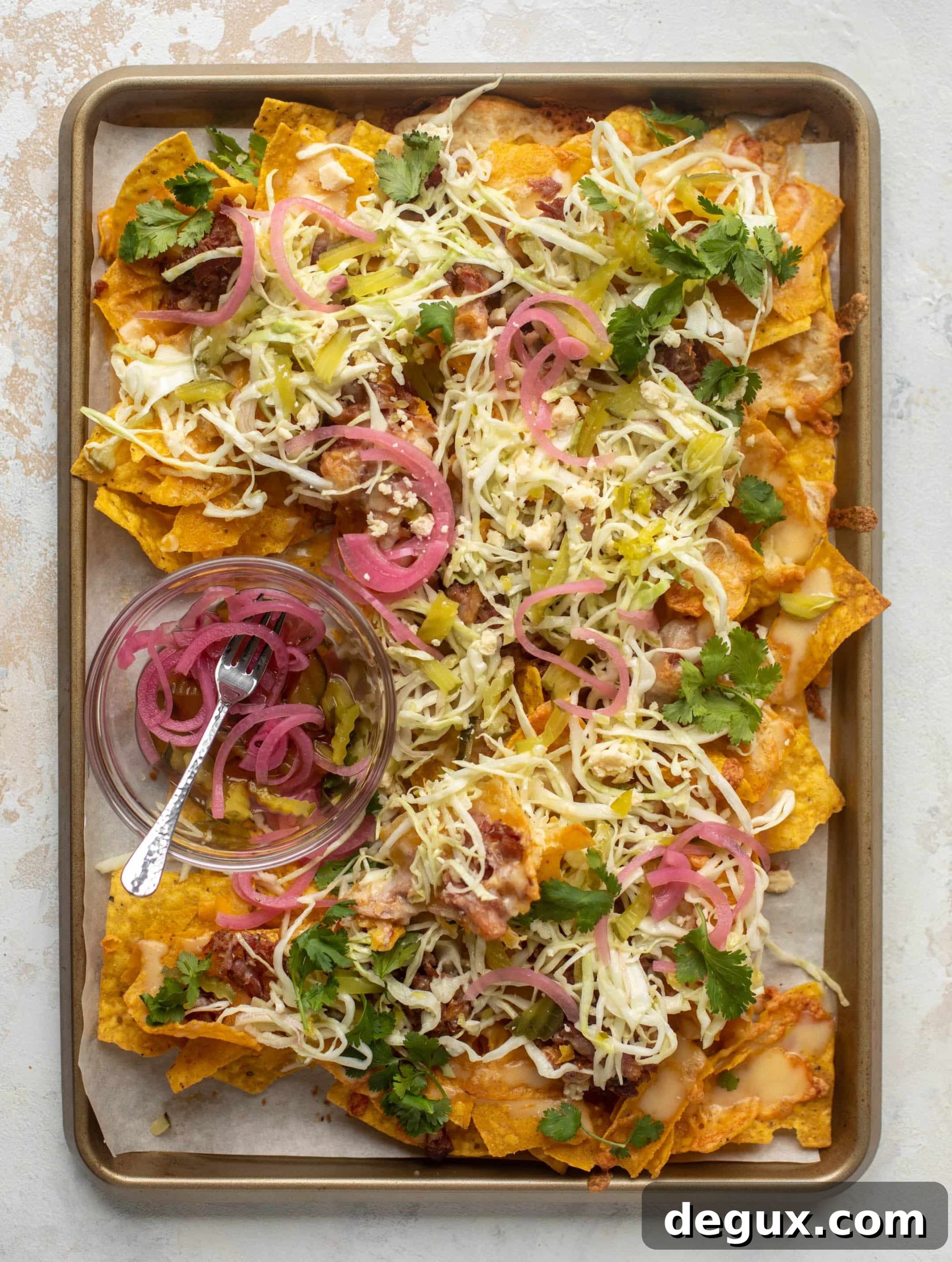 pulled pork nachos with pickle slaw