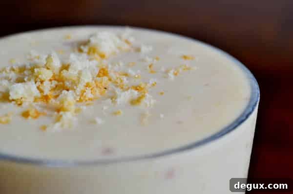 Shake-4 Glass of peach milkshake with cookie crumbs