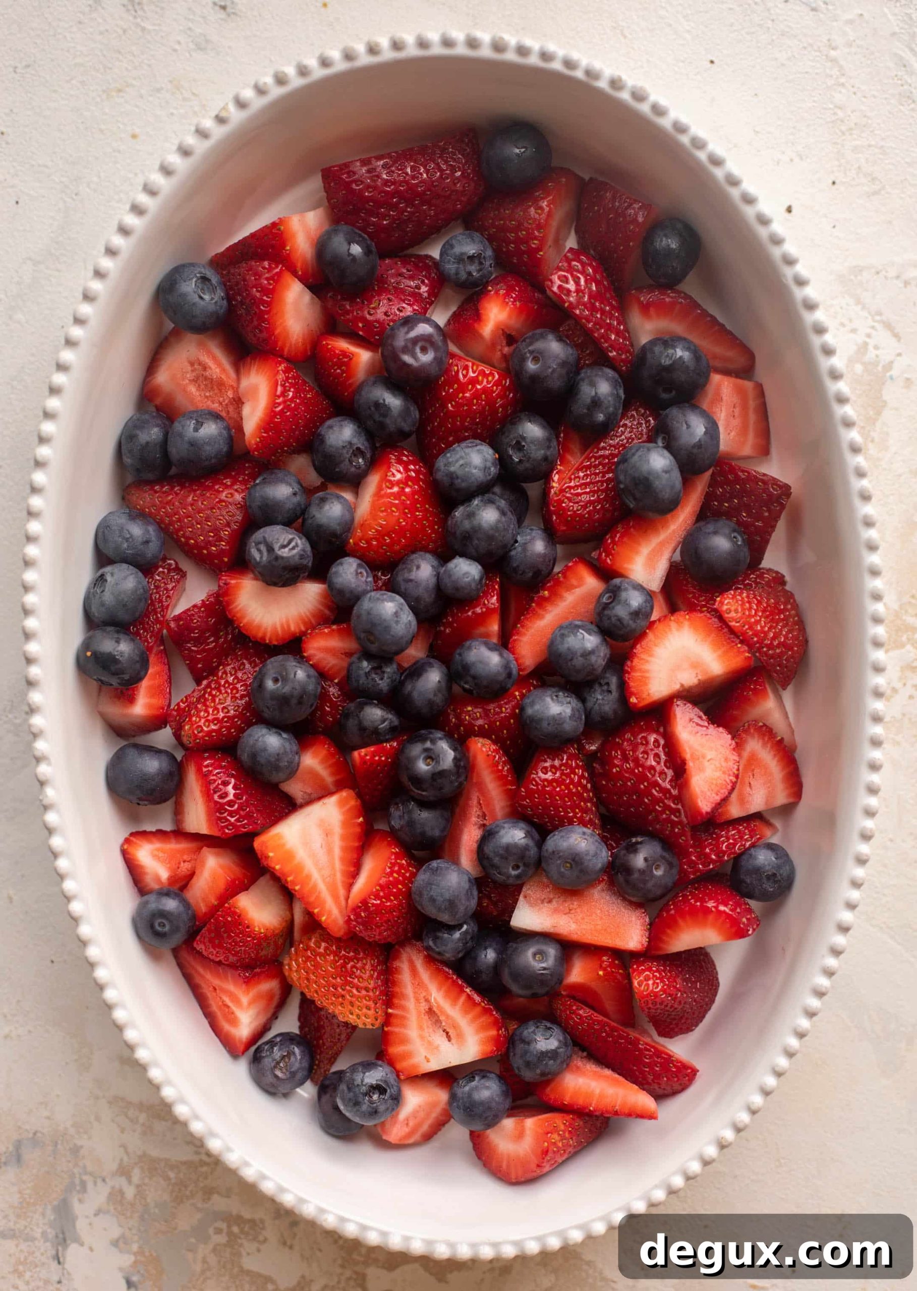 Double-Berry Mascarpone Cobbler Recipe for Summer Desserts 3 strawberries and blueberries