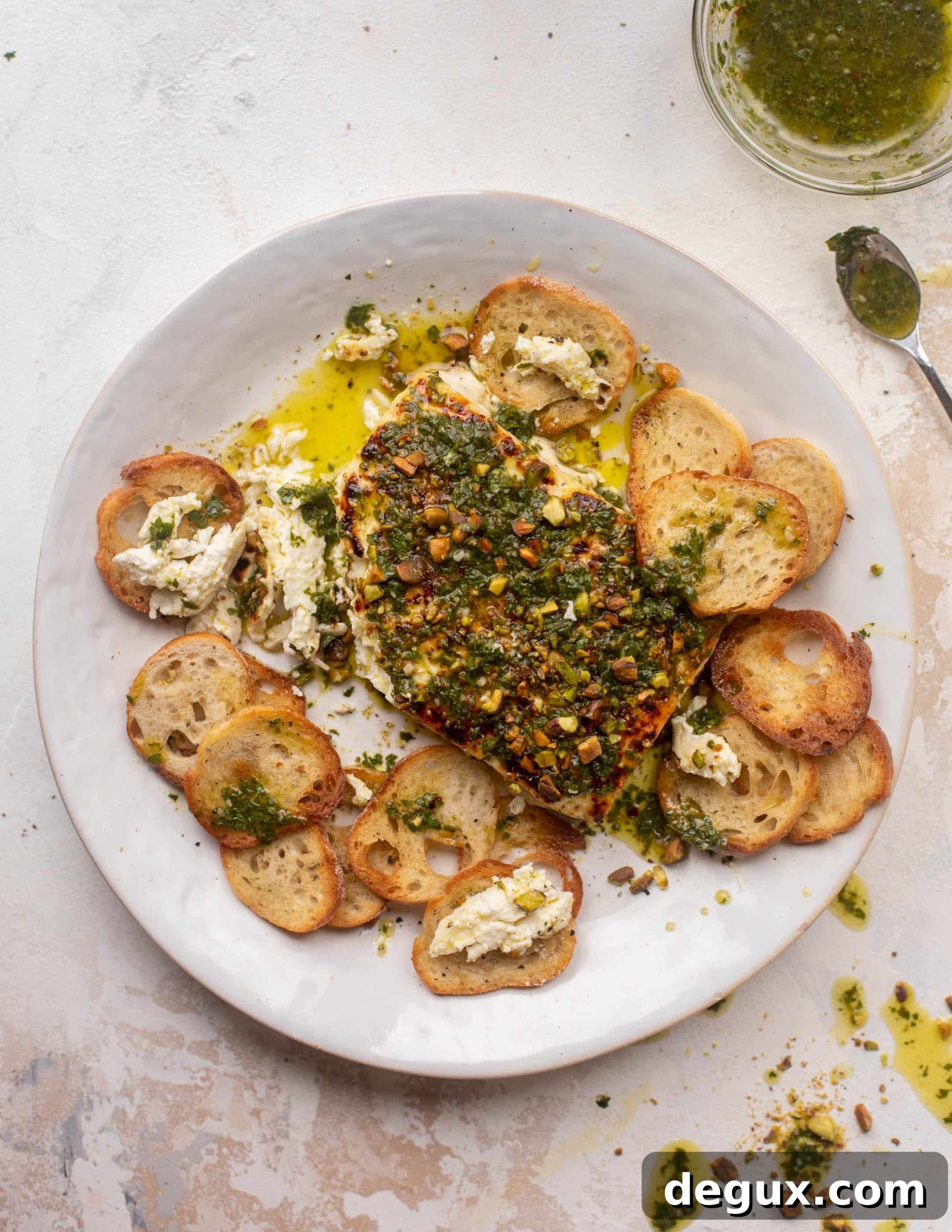 grilled feta with pistachios and chimichurri