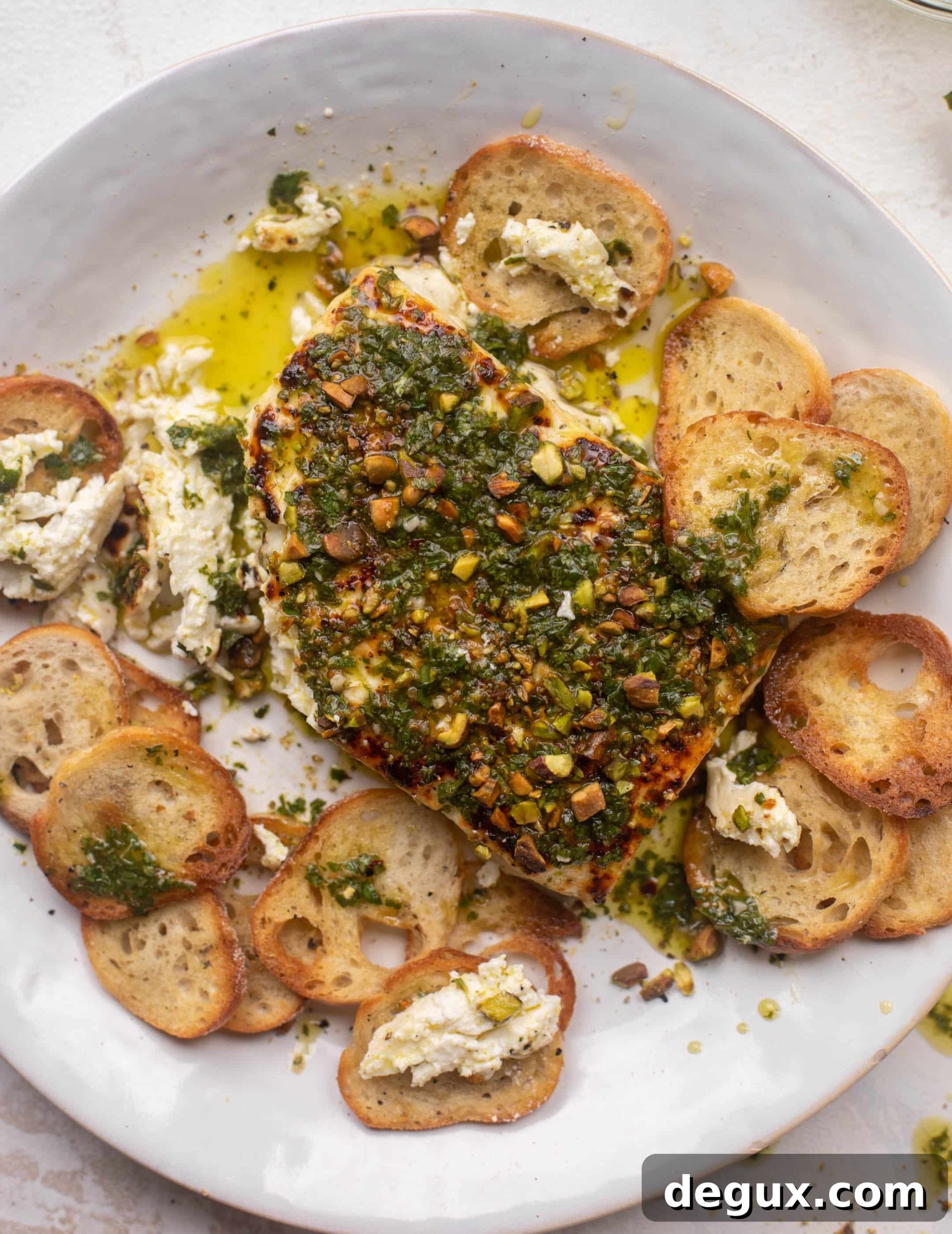 grilled feta with pistachios and chimichurri