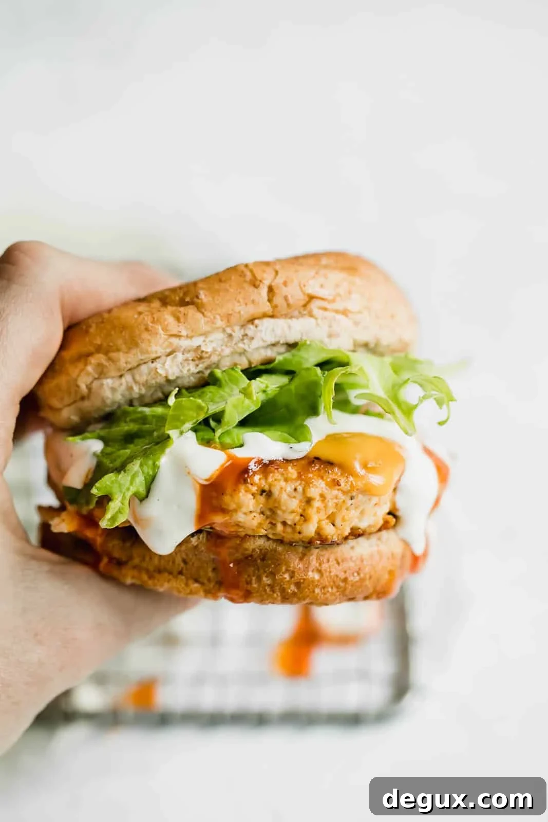 Spicy Buffalo Chicken Burger Recipe with Blue Cheese Slaw 2 buffalo chicken burgers I howsweeteats.com #buffalo #chicken #burgers