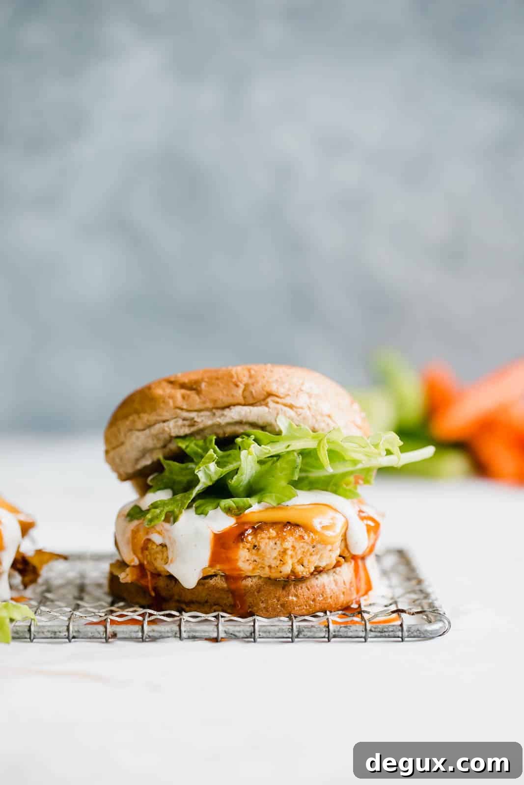 Spicy Buffalo Chicken Burger Recipe with Blue Cheese Slaw 4 buffalo chicken burgers I howsweeteats.com #buffalo #chicken #burgers