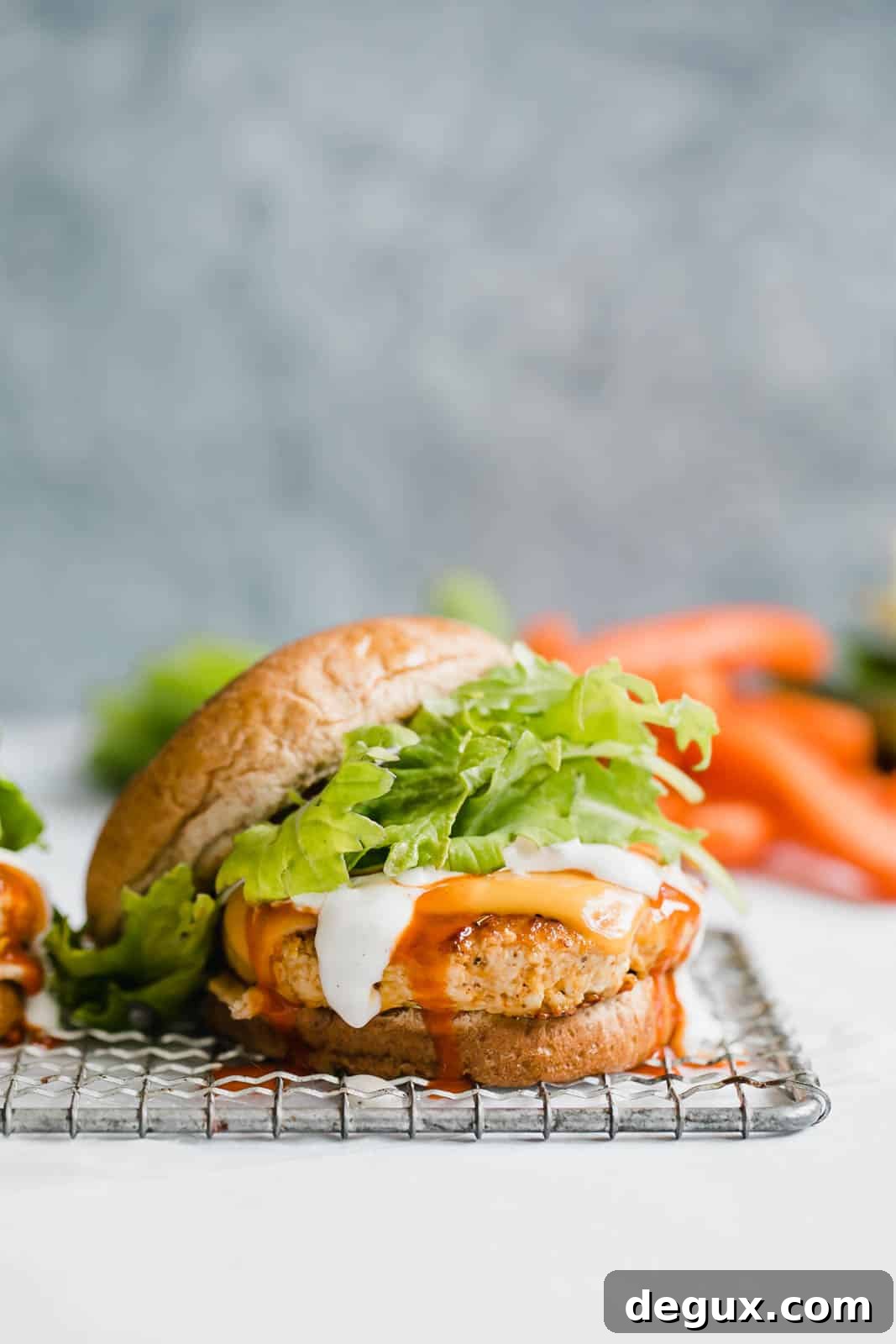 Spicy Buffalo Chicken Burger Recipe with Blue Cheese Slaw 5 buffalo chicken burgers I howsweeteats.com #buffalo #chicken #burgers