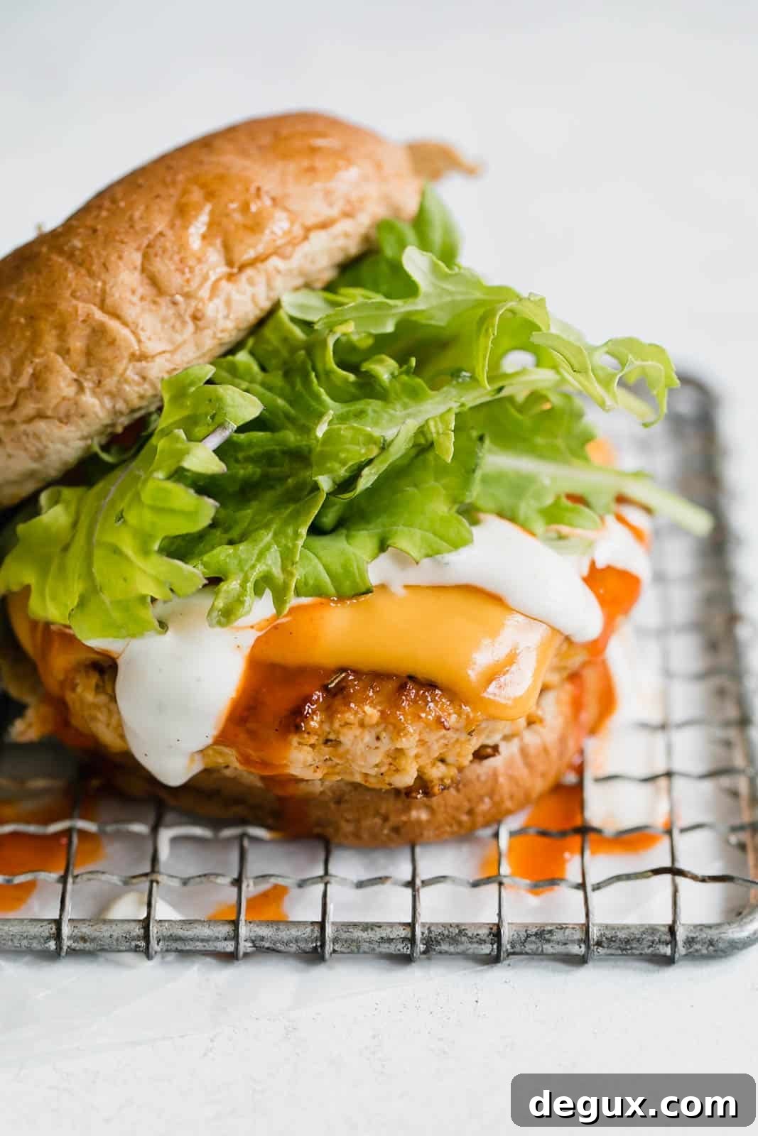 Spicy Buffalo Chicken Burger Recipe with Blue Cheese Slaw 8 buffalo chicken burgers I howsweeteats.com #buffalo #chicken #burgers