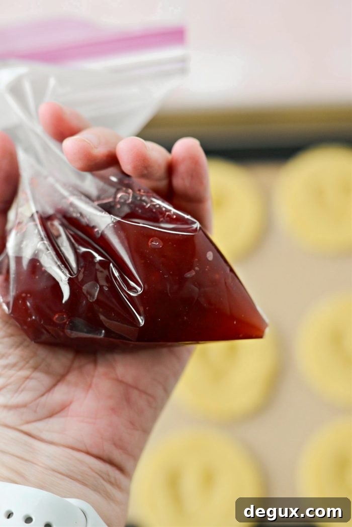add jam to a piping bag or resealable baggie