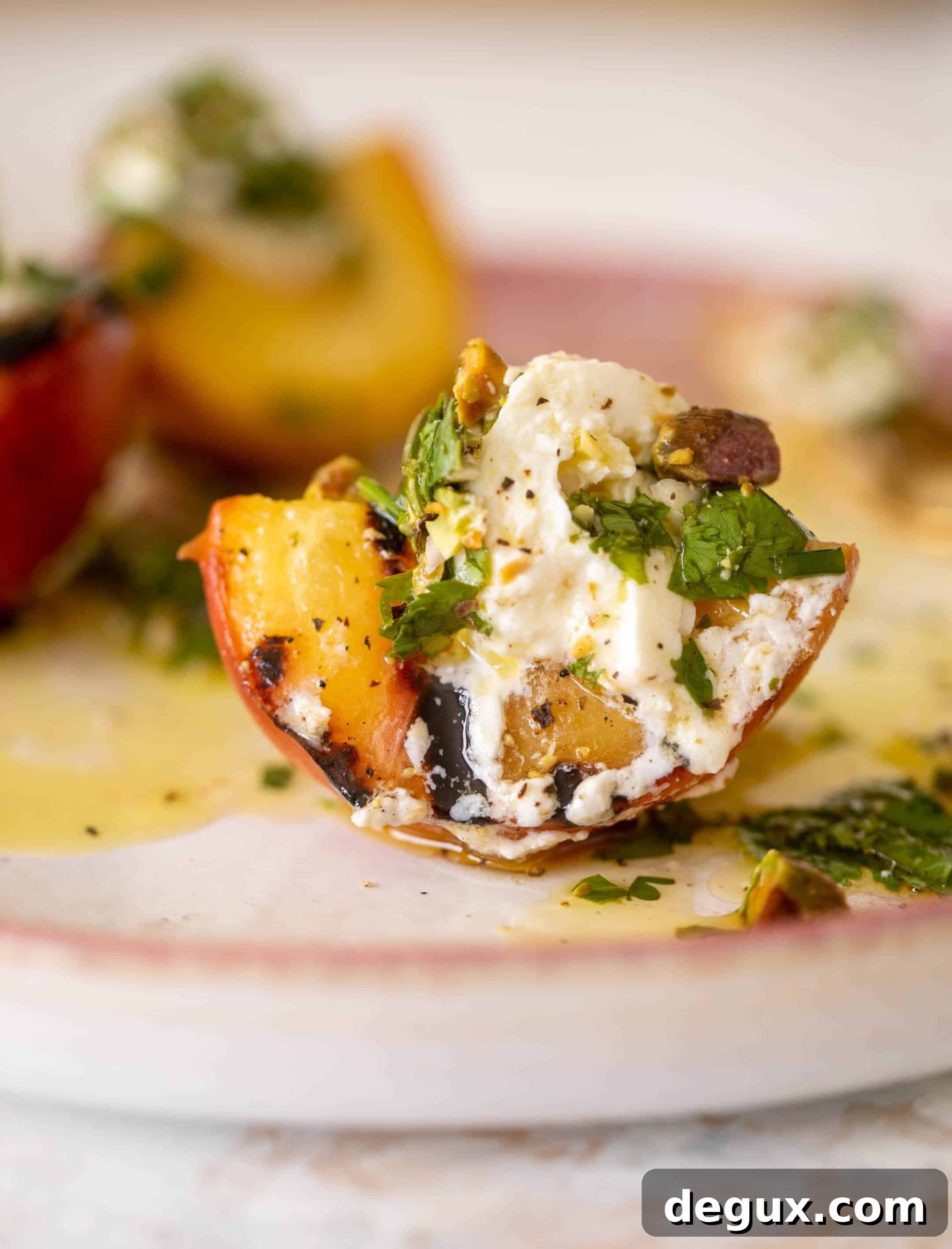 Grilled Peaches with Burrata and Pistachio-Herb Vinaigrette 2 grilled peaches with burrata and pistachio vinaigrette