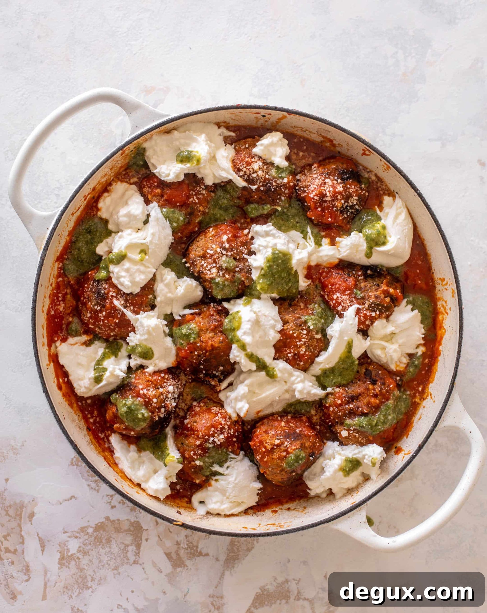 Baked Pesto Meatballs with Burrata and Melted Cheese 6 cheesy baked pesto meatballs with burrata