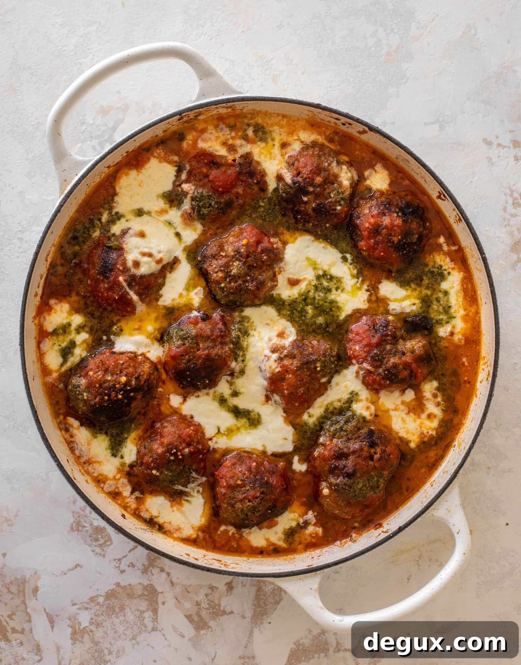 Baked Pesto Meatballs with Burrata and Melted Cheese 7 cheesy baked pesto meatballs with burrata