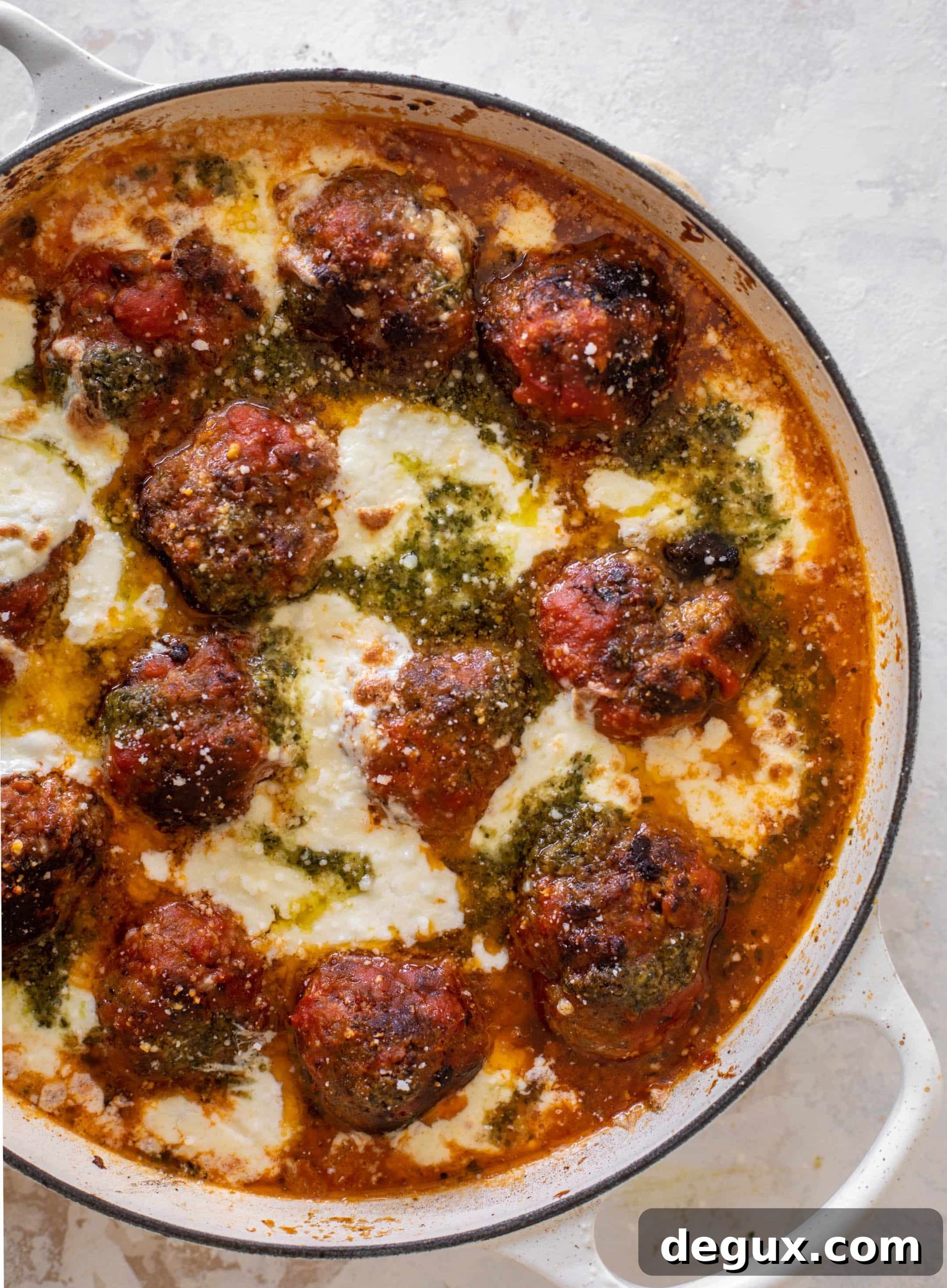 Baked Pesto Meatballs with Burrata and Melted Cheese 8 cheesy baked pesto meatballs with burrata
