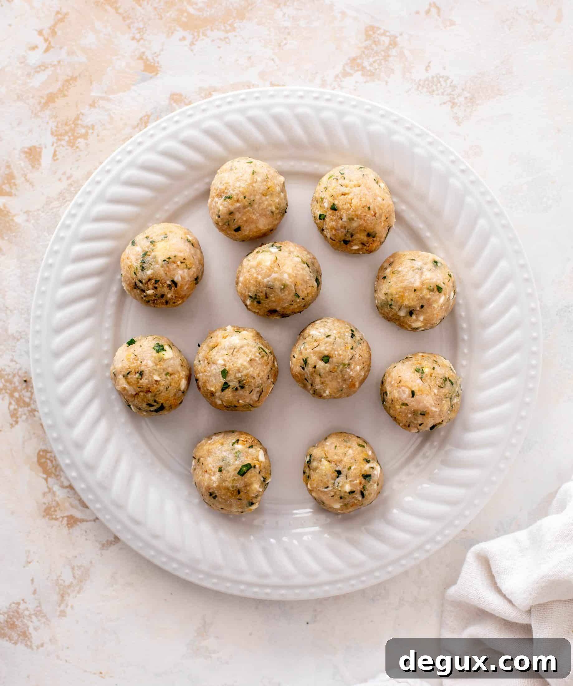 sheet pan chicken meatballs with tomatoes and feta