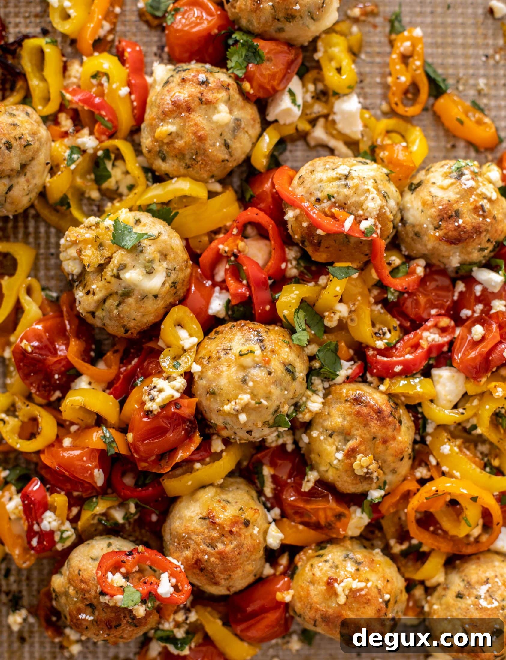 sheet pan chicken meatballs with tomatoes and feta