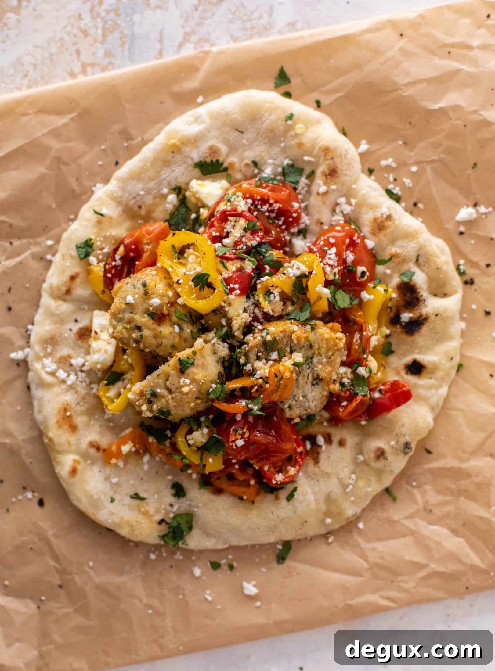sheet pan chicken meatballs with tomatoes and feta