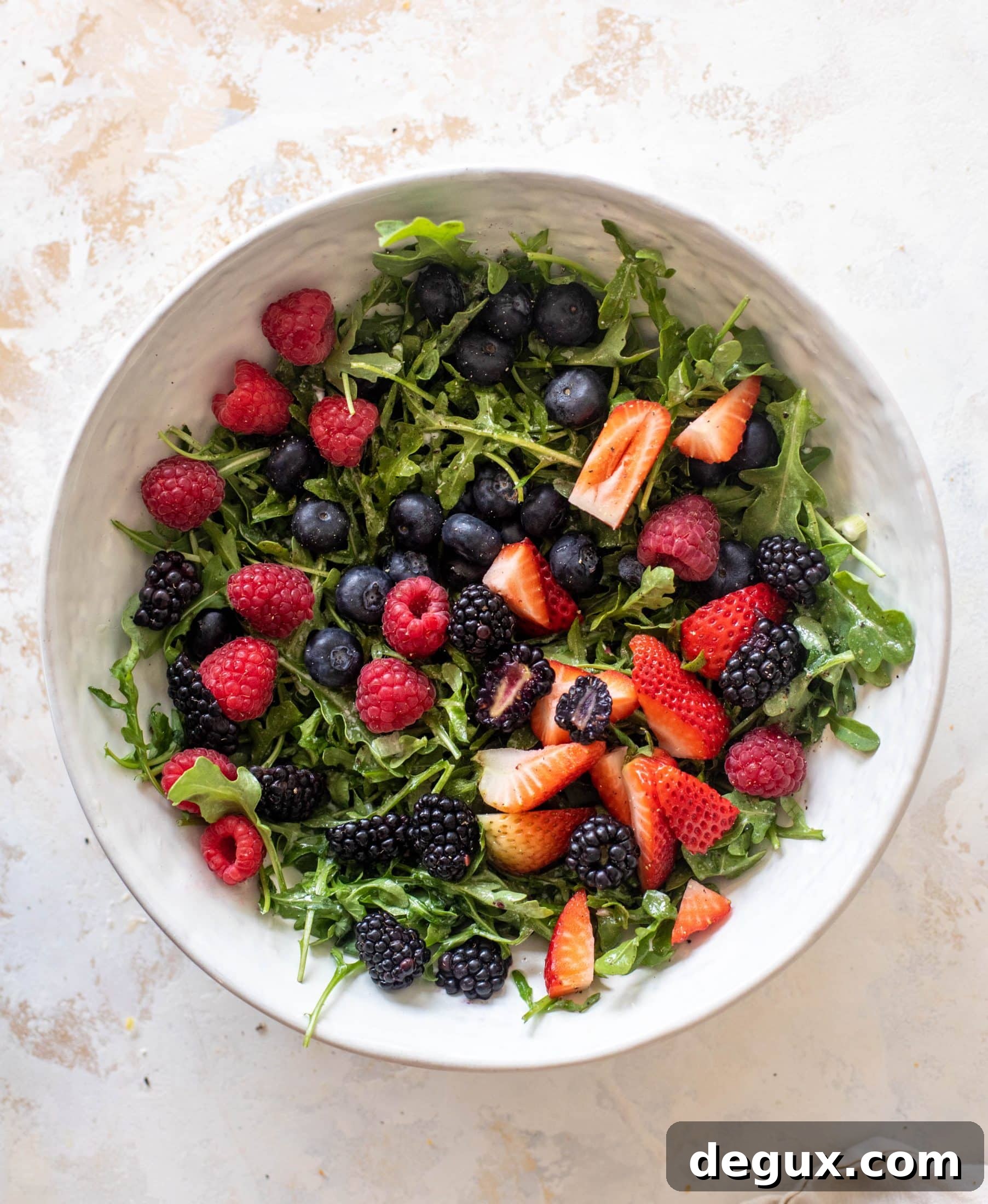red white and berry arugula salad