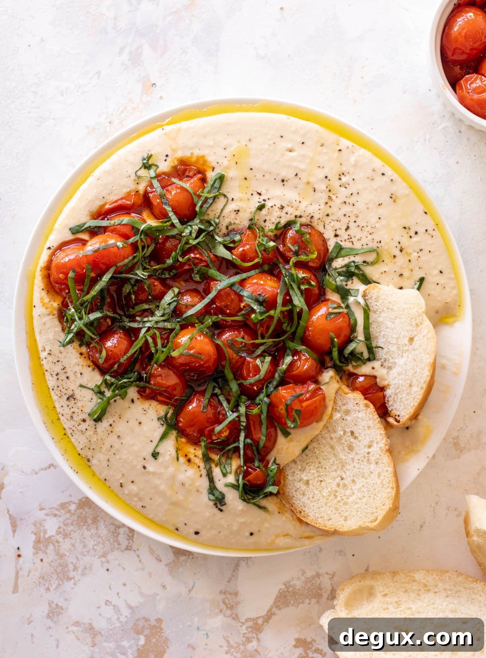 white bean dip with burst tomatoes