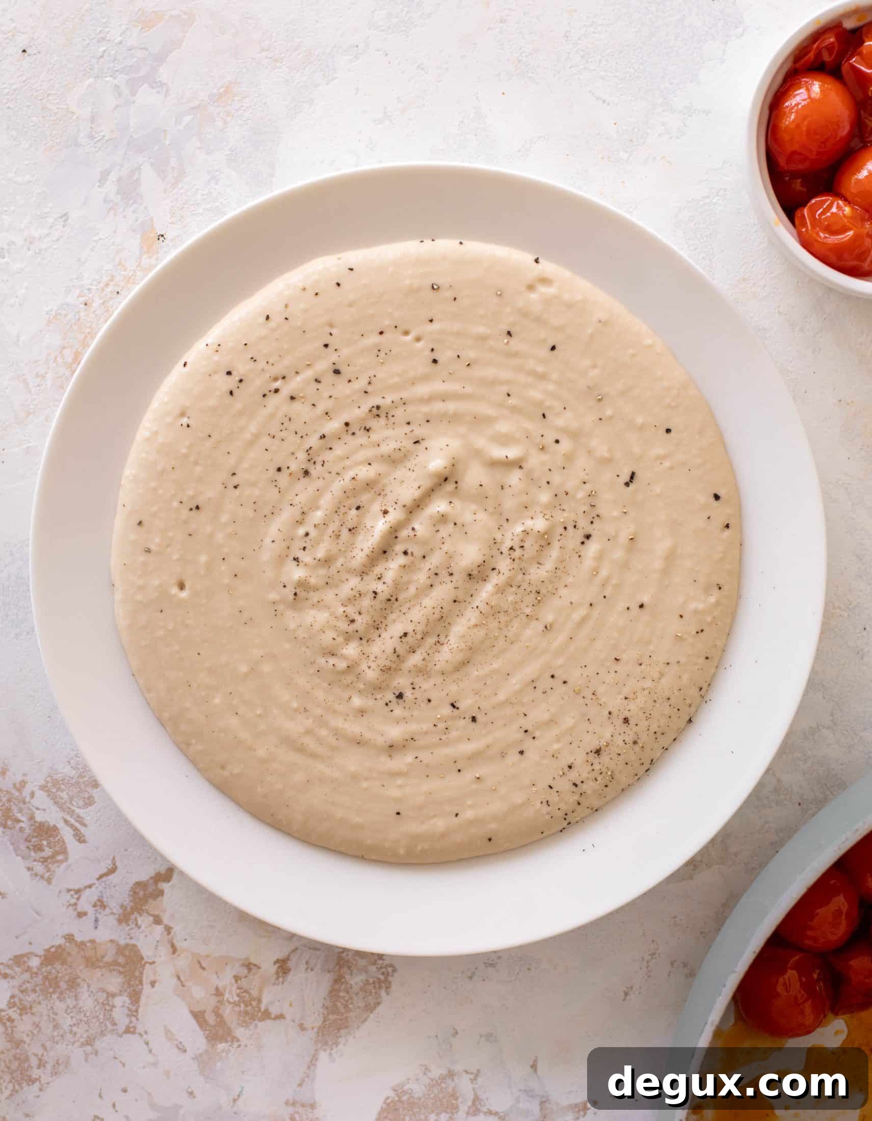 white bean dip with burst tomatoes