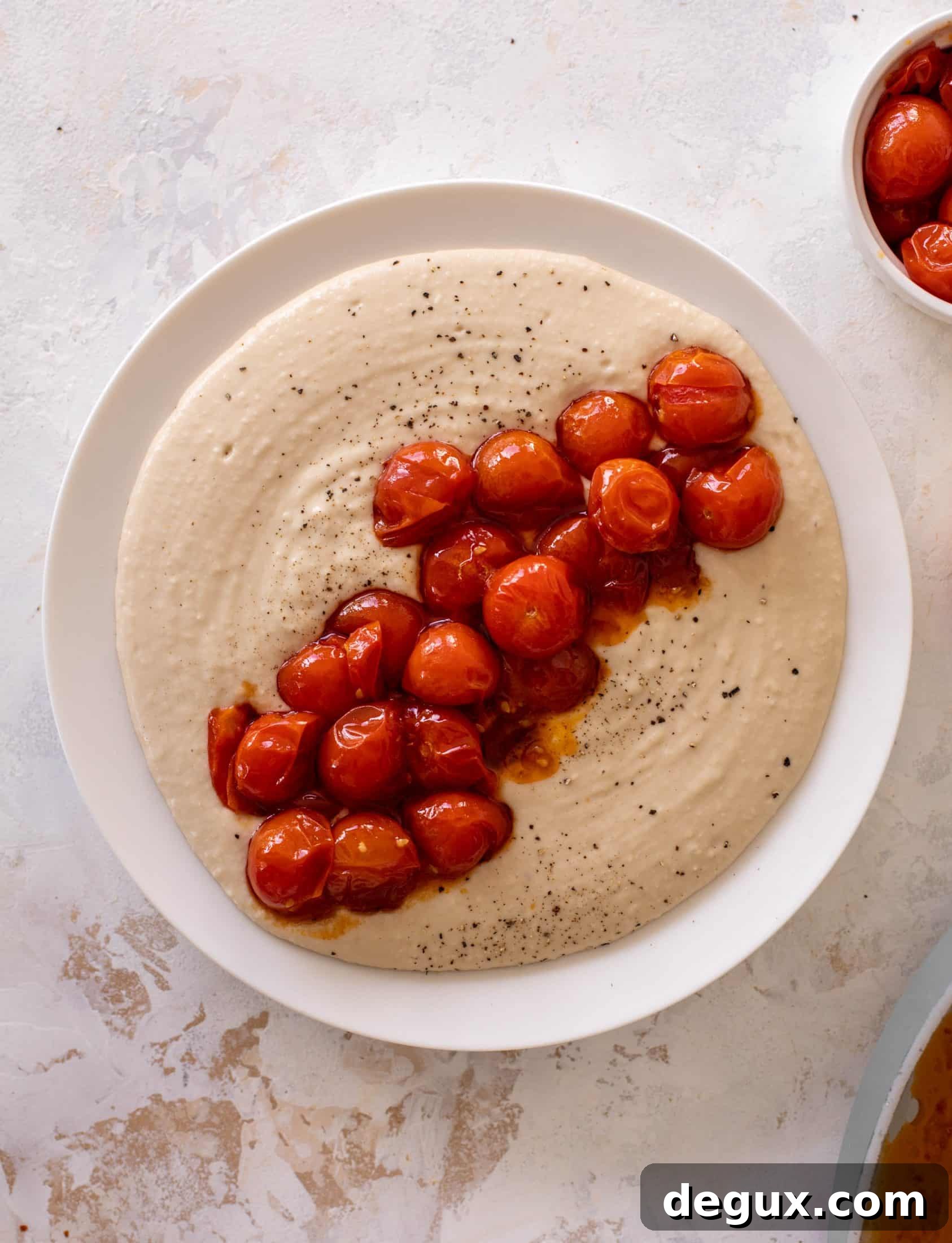 white bean dip with burst tomatoes