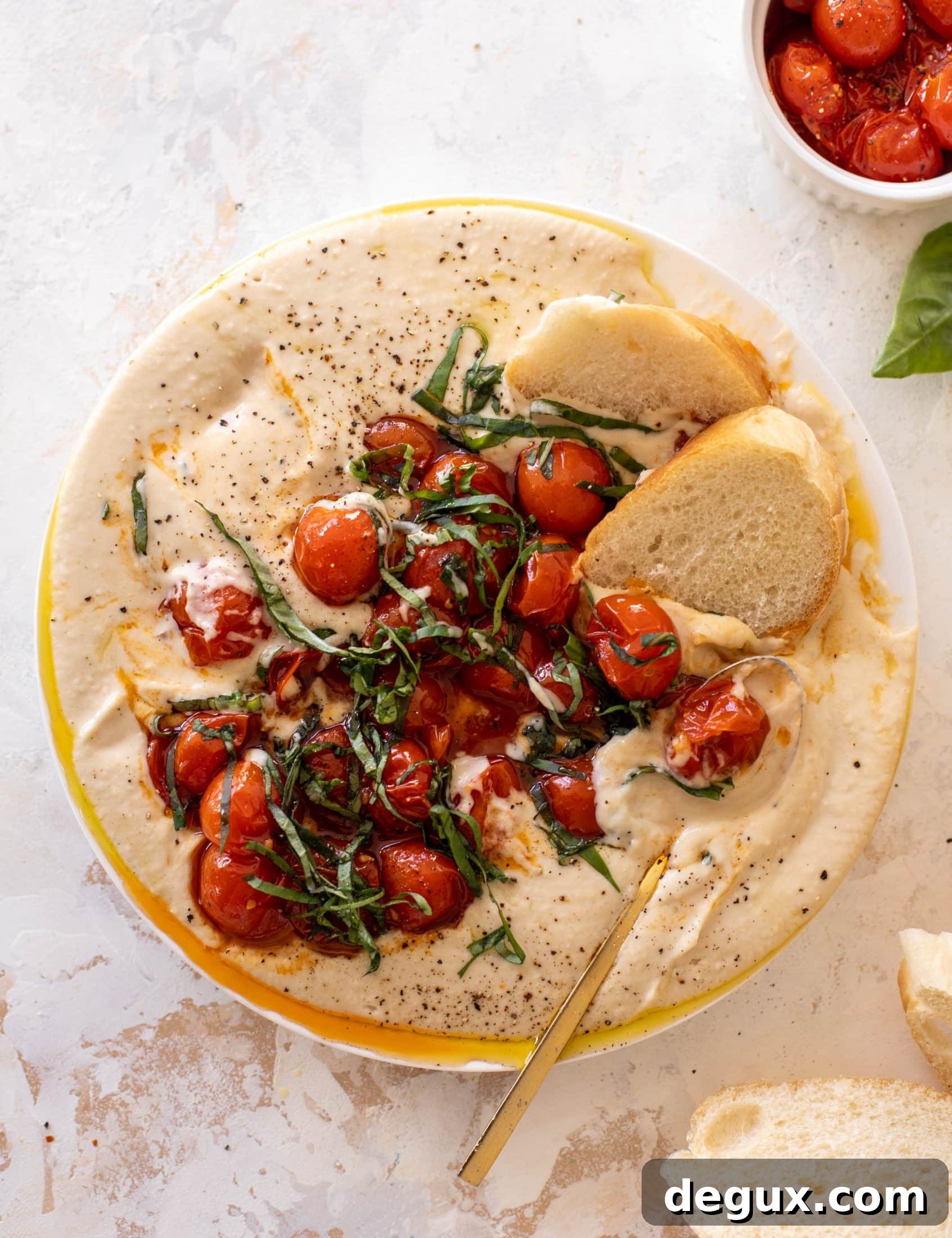 white bean dip with burst tomatoes